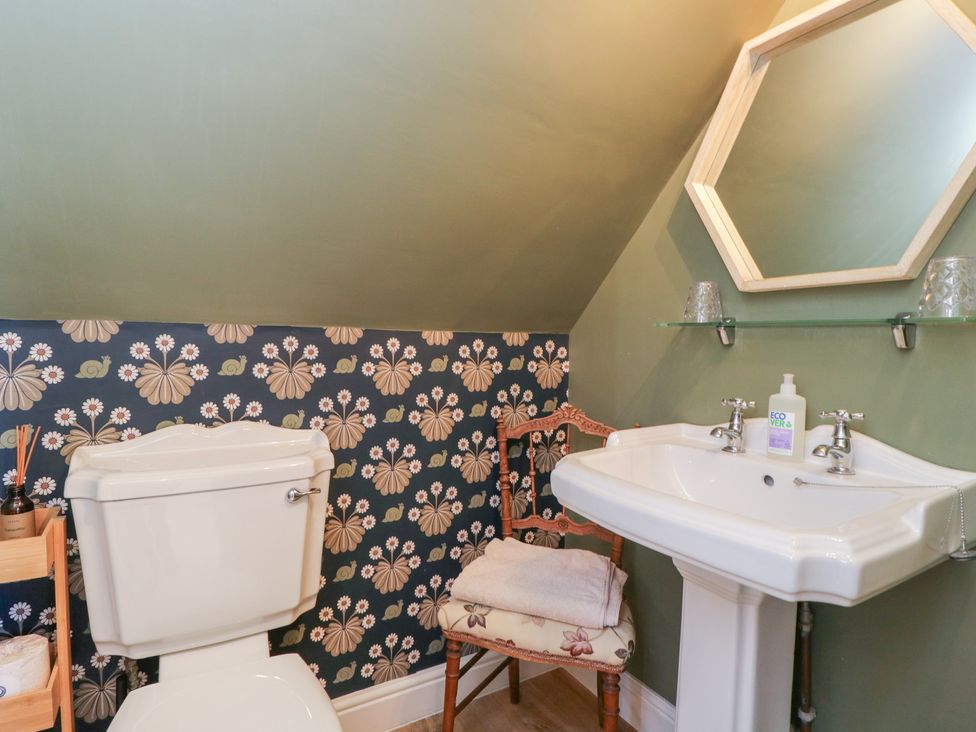 A bathroom with a toilet and sink at The Hideaway Loft in Chippenham