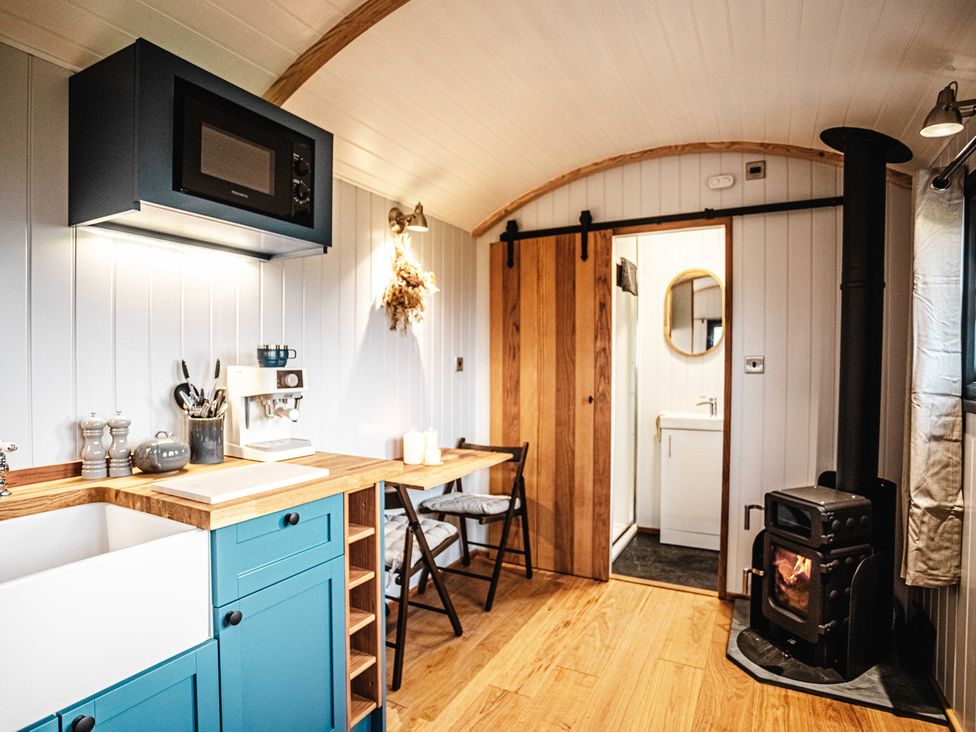 A kitchen with a stove and sink at Shepherds View in Bradley near Ashbourne