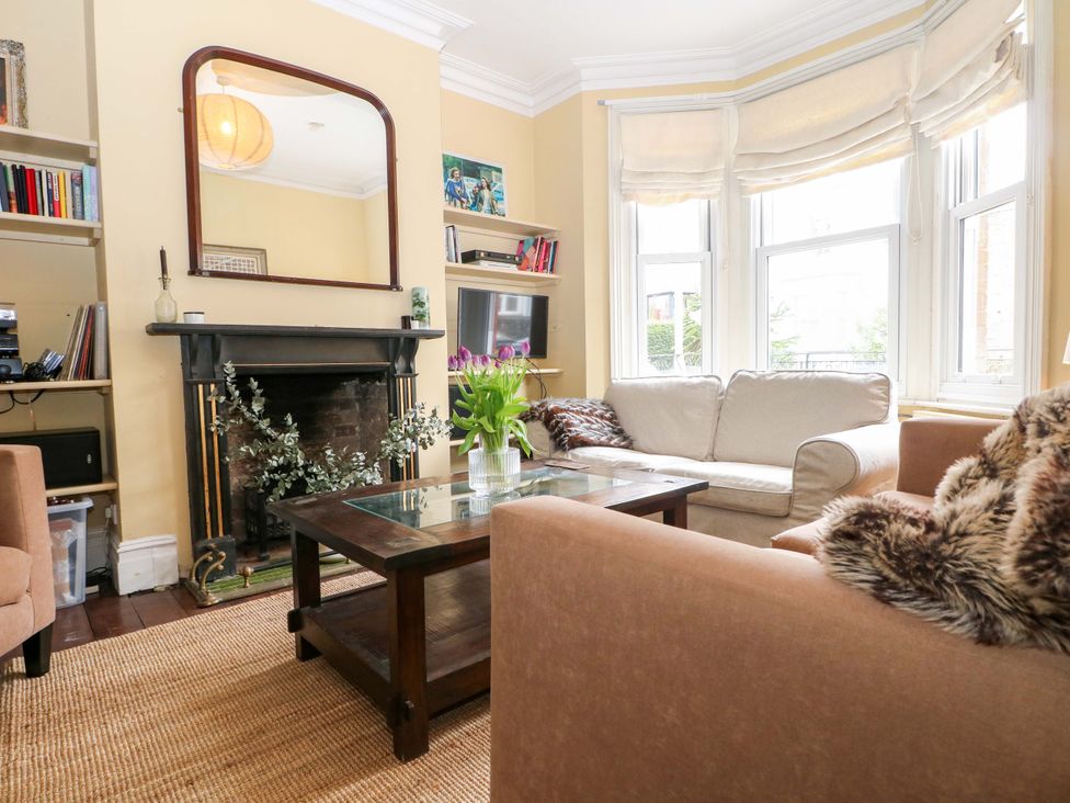 A living room with a sofa and coffee table at Tickety-Boo in Broadstairs