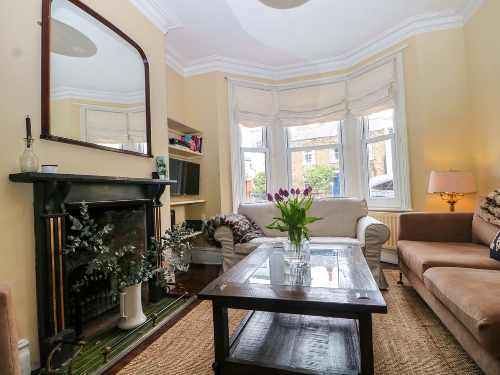 A living room with a sofa and coffee table at Tickety-Boo in Broadstairs