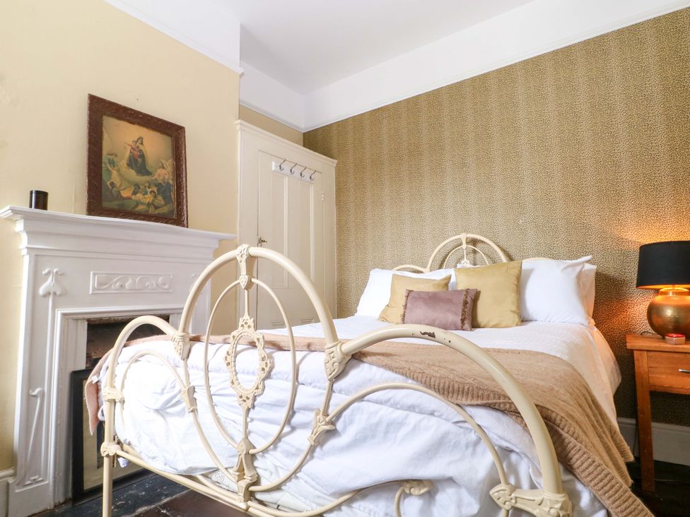 A bedroom with a bed and a bedside table at Tickety-Boo in Broadstairs