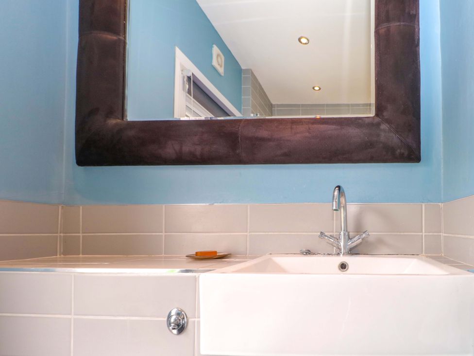 A bathroom with a sink and mirror at Tickety-Boo in Broadstairs