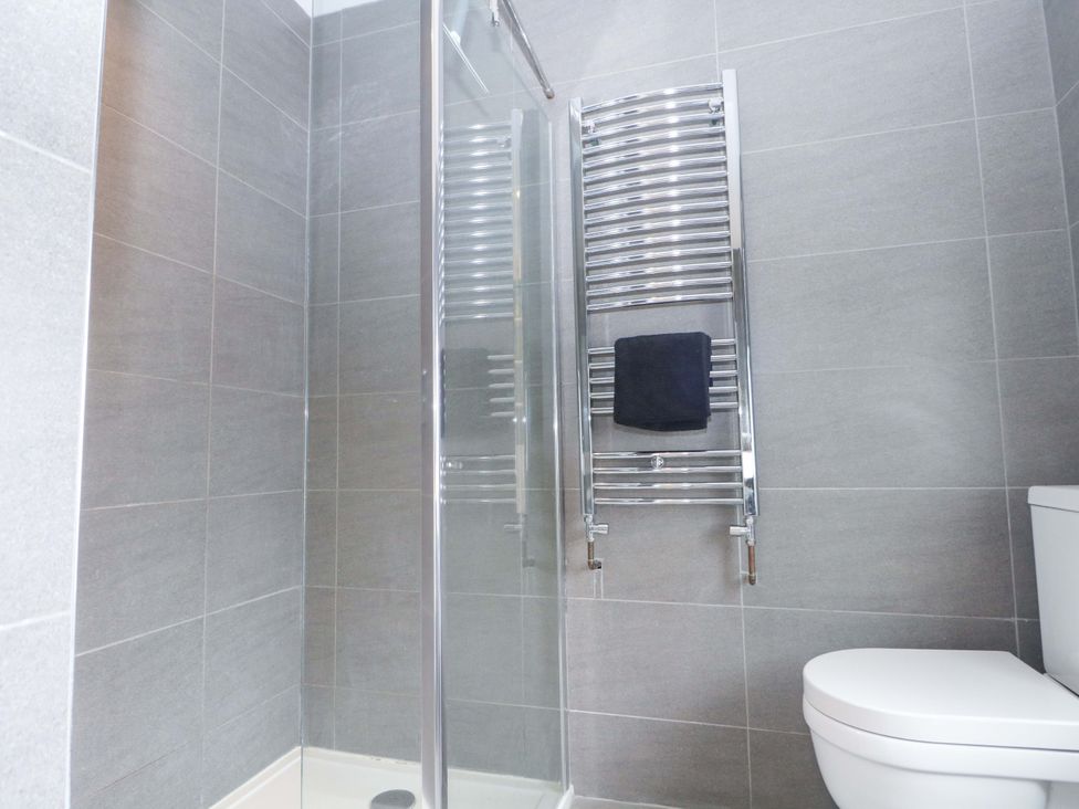 A bathroom with a shower and a towel radiator at Tickety-Boo in Broadstairs