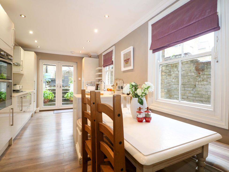 A kitchen with dining table and chairs at Tickety-Boo in Broadstairs