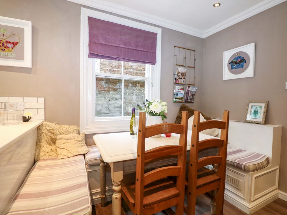 A dining area with a table and seating at Tickety-Boo in Broadstairs