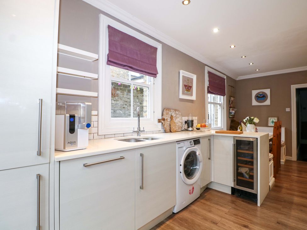 A kitchen with a sink and washing machine at Tickety-Boo in Broadstairs