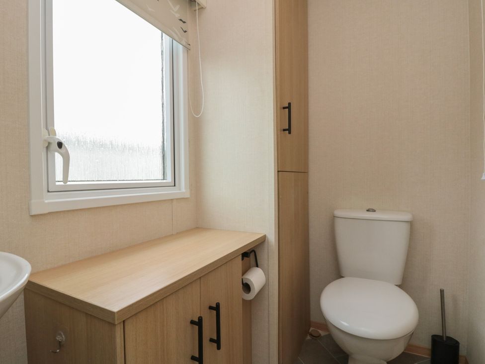 A bathroom with a sink and toilet at 21 Dunlin Dell in Flamborough