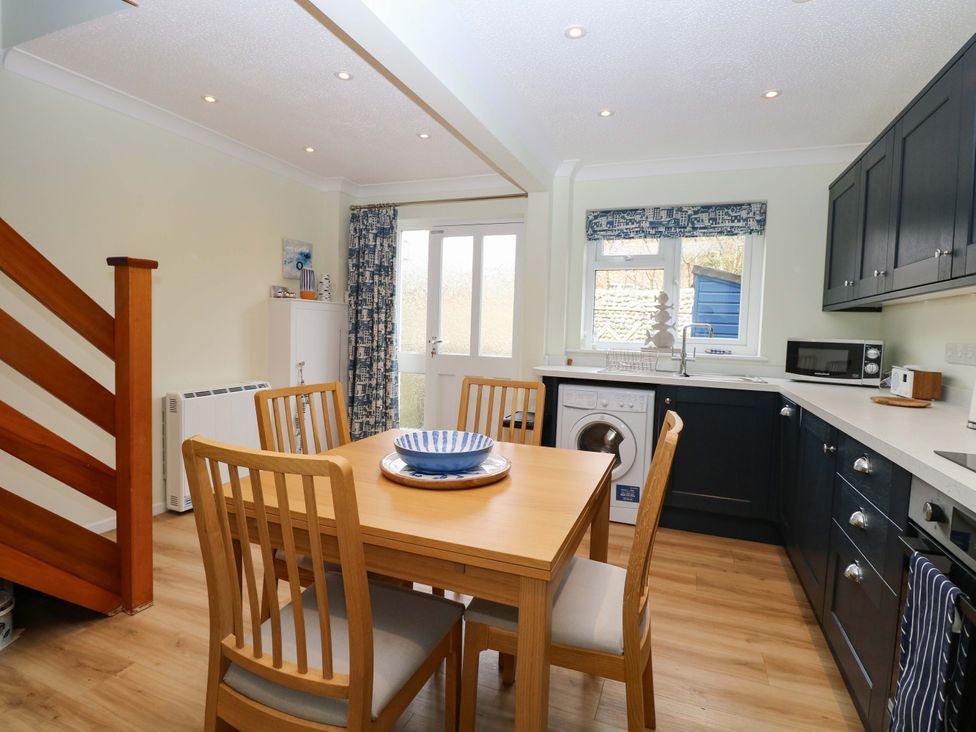 A kitchen with a table and chairs at Old Summer Northrepps near Cromer