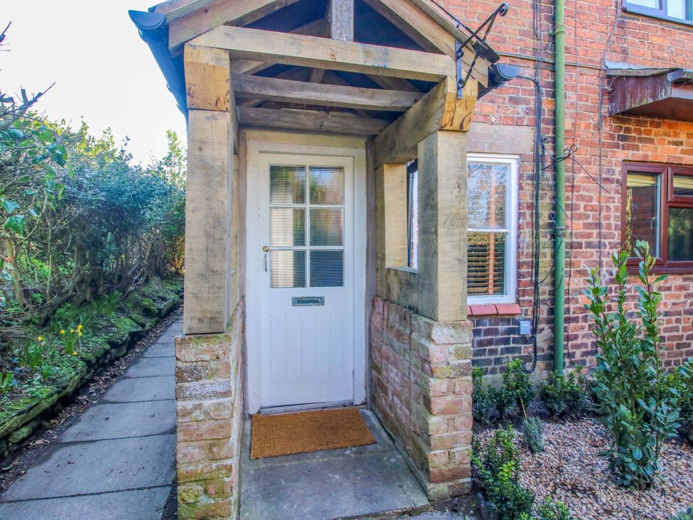 An entrance with a door and plants at Cheshire Views in Malpas