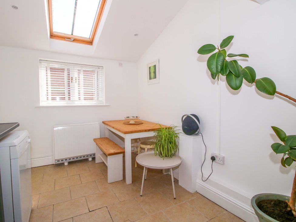A kitchen with a table and chairs at Cheshire Views in Malpas