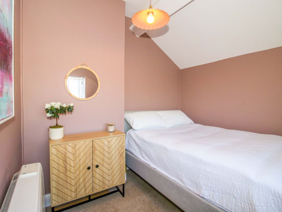 A bedroom with a bed and cabinet at Cheshire Views in Malpas