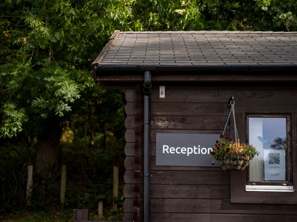 A reception area of a wooden building at Bracelands - Cosy Pod 5 in Coleford