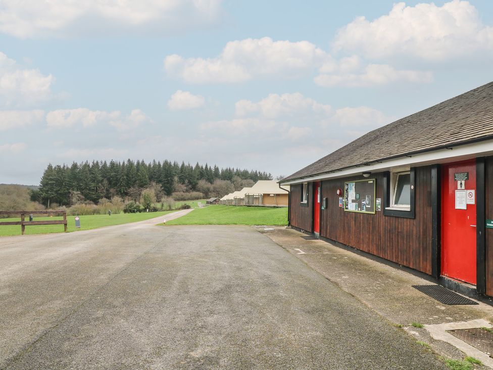 An outdoor area with a building and road at Bracelands - Safari Tent 1, Coleford