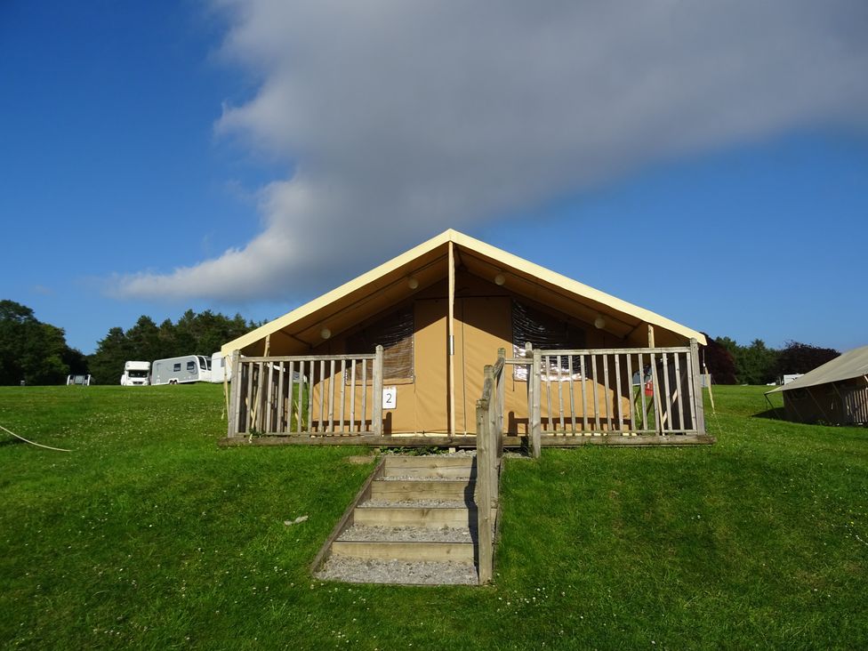 A tent with steps and fence at Bracelands - Safari Tent 3 Coleford
