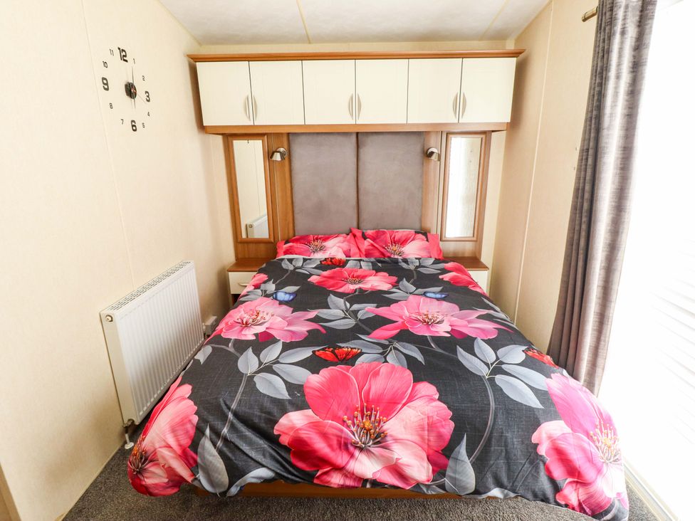 A bedroom with a bed and wardrobe at Loopy’s Place - PG178 Chapel St Leonards