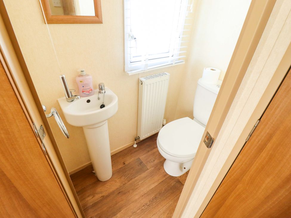 A bathroom with a sink and toilet at Loopy’s Place - PG178, Chapel St Leonards