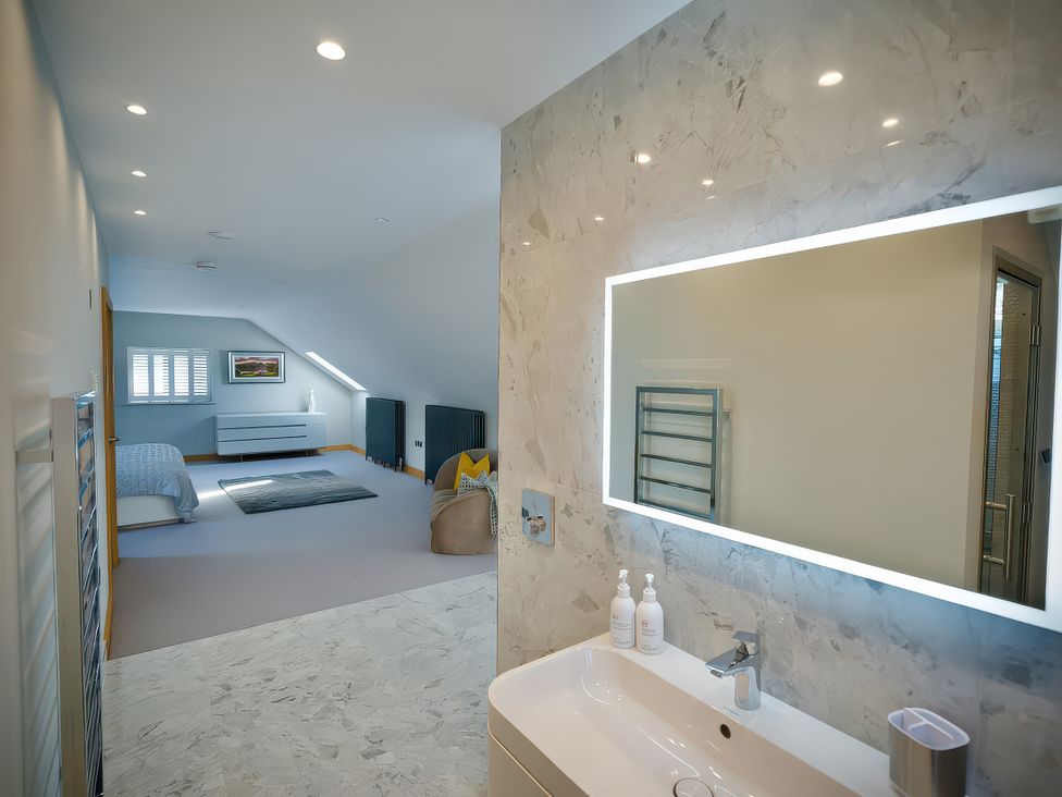 A bathroom featuring a sink and mirror at Midways in Bowness-On-Windermere