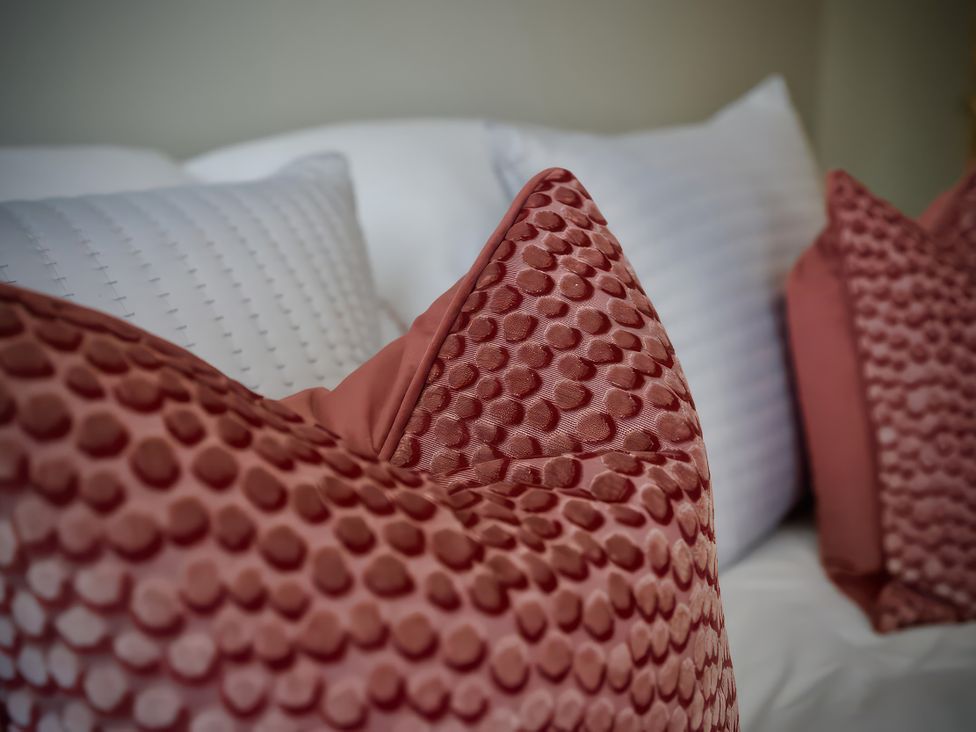 A close-up of pillows on a couch at Midways in Bowness-On-Windermere