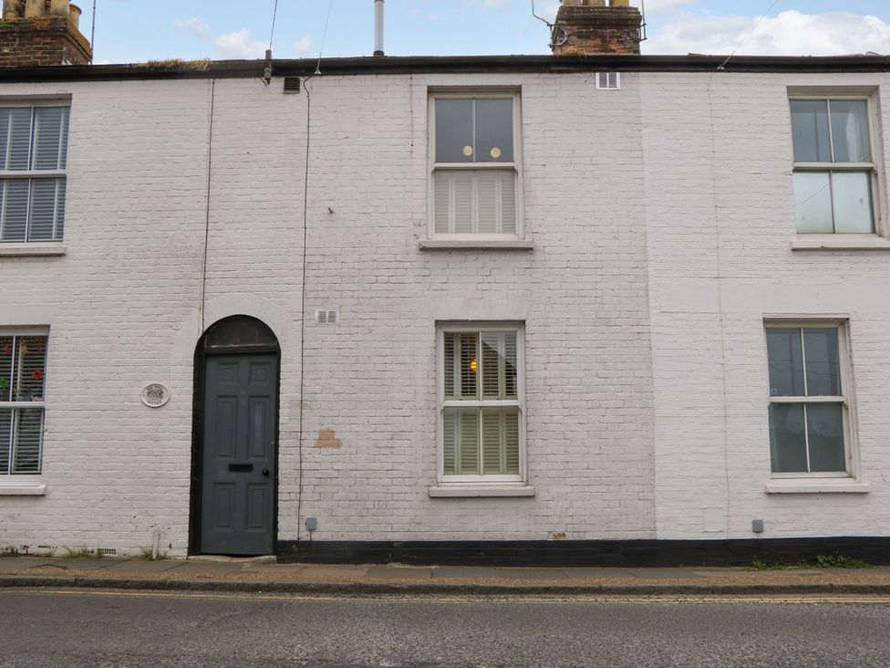 An outdoor view of a house with windows and a door at 3 Cinque Ports Street in Rye