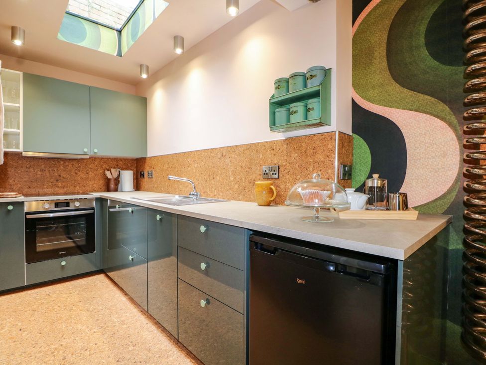 A kitchen with cabinets, countertop, oven, sink, and refrigerator at 3 Cinque Ports Street in Rye