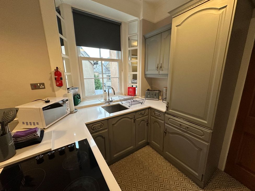 A kitchen with a sink and window at The Teviot in Kelso