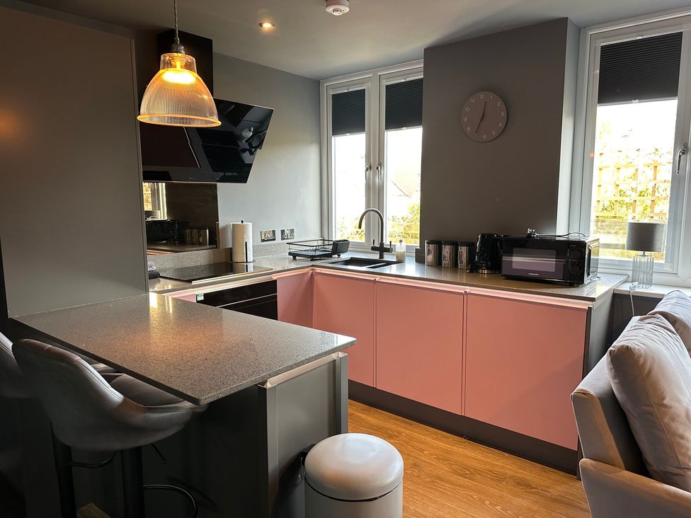A kitchen with sink and microwave at The Tay in Melrose