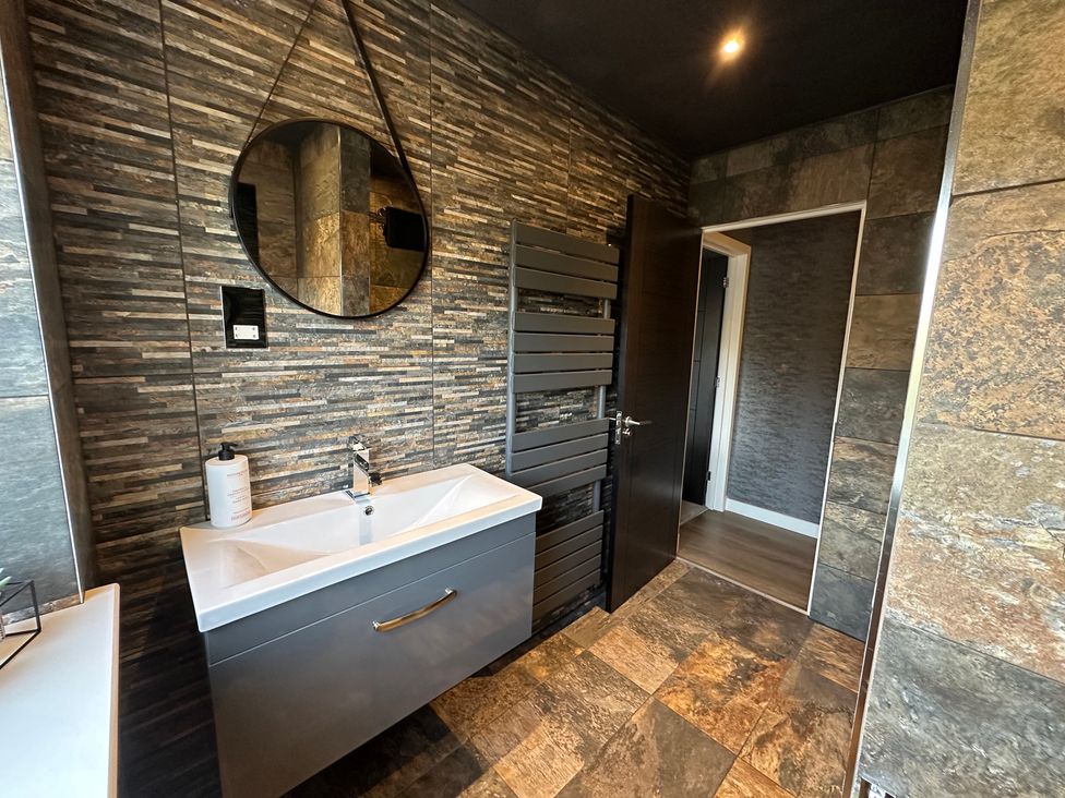 A bathroom with a sink and a mirror at The Tay in Melrose