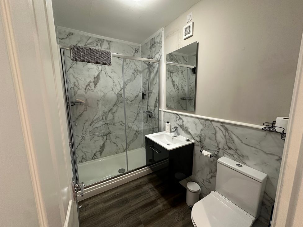 A bathroom with shower, toilet, and sink at The Esk in Melrose