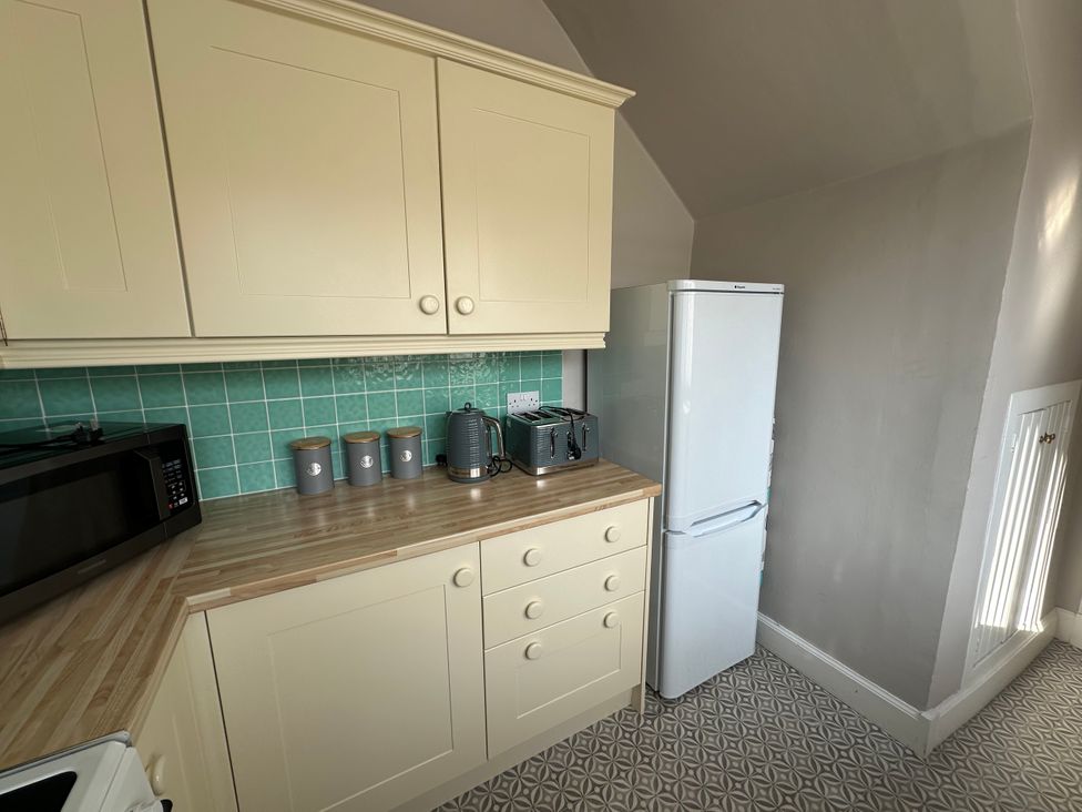 A kitchen with appliances on a countertop at Pergola in Melrose