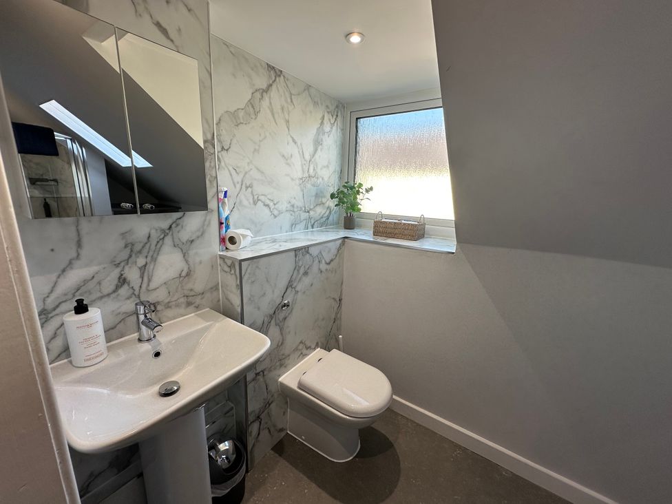 A bathroom with a sink and toilet at Pergola Melrose