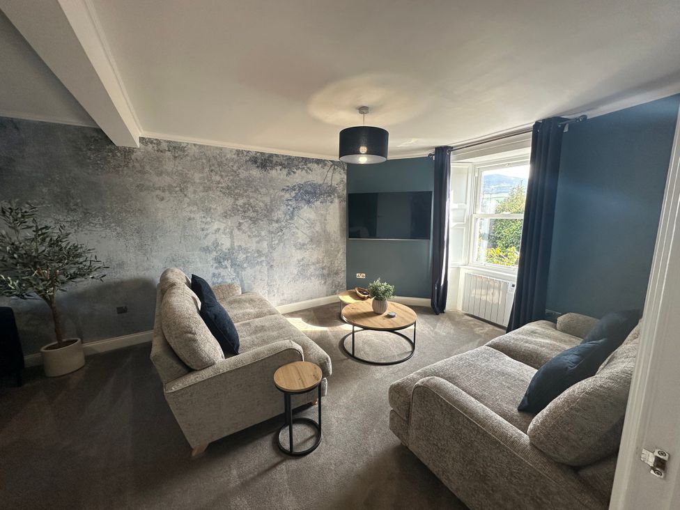 A living room with furniture and a television at Broombank in Melrose