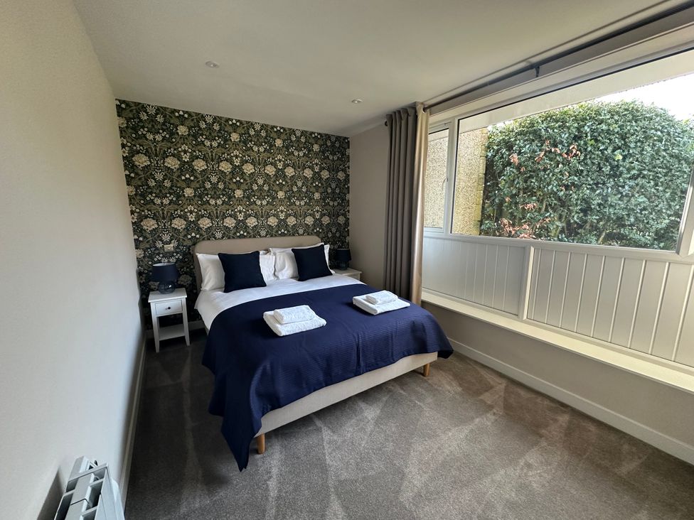 A bedroom with a bed and window at Broombank in Melrose