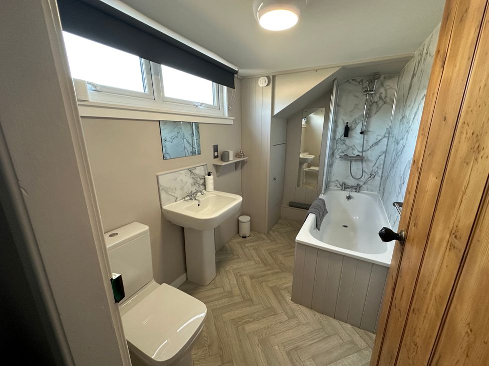 A bathroom with a sink, toilet, bathtub, and shower at Broombank in Melrose