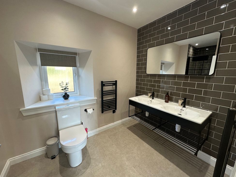 A bathroom with a double sink and a toilet at Broombank in Melrose