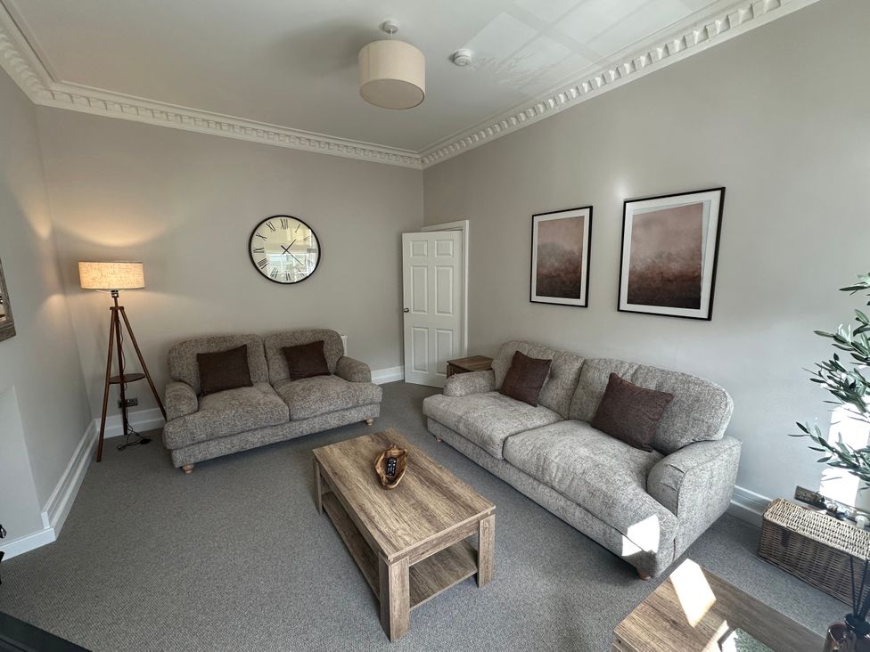 A living room with sofas and a coffee table at Horsemarket in Kelso