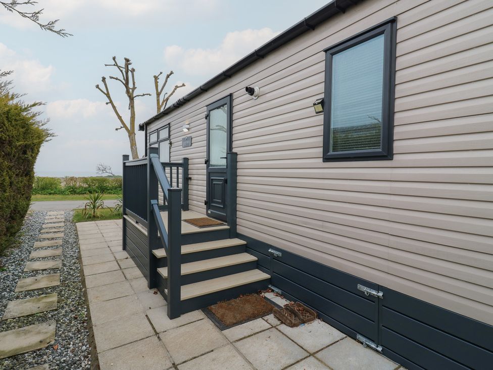 An exterior view of a mobile home with steps at no 20 Barley Way Colchester