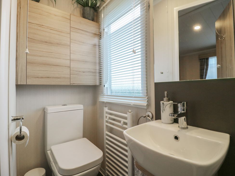 A bathroom with a sink and toilet at no 20 Barley Way Colchester