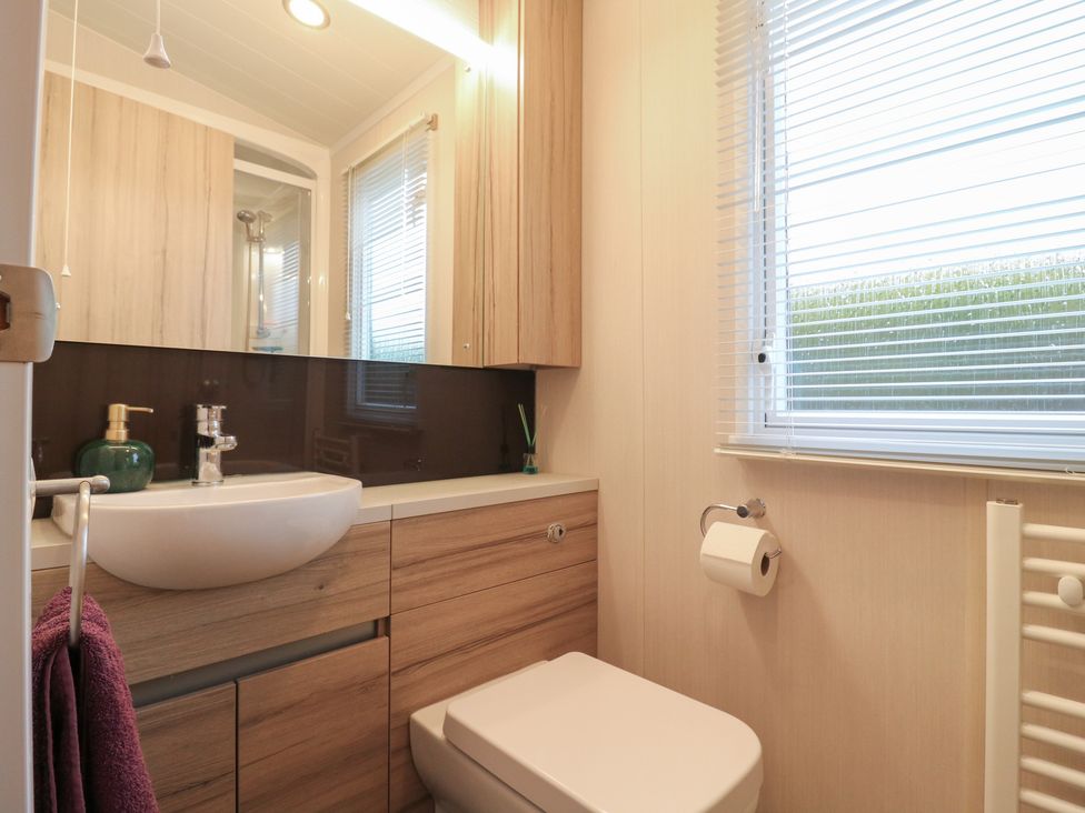 A bathroom with a sink and toilet at no 20 Barley Way in Colchester