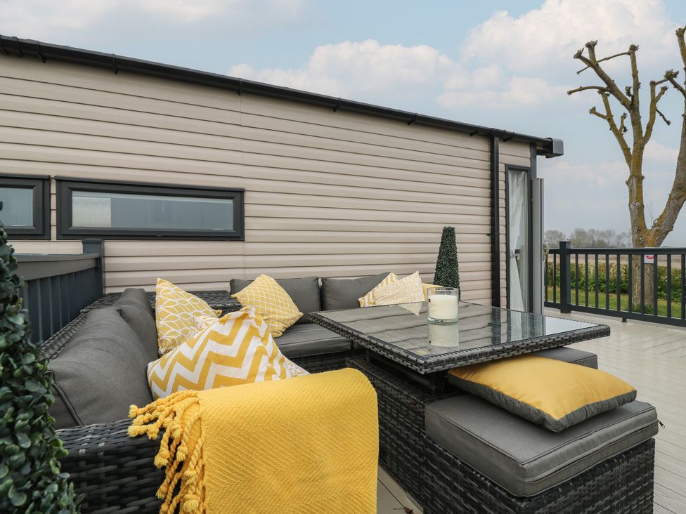 An outdoor area with seating and a table at no 20 Barley Way Colchester