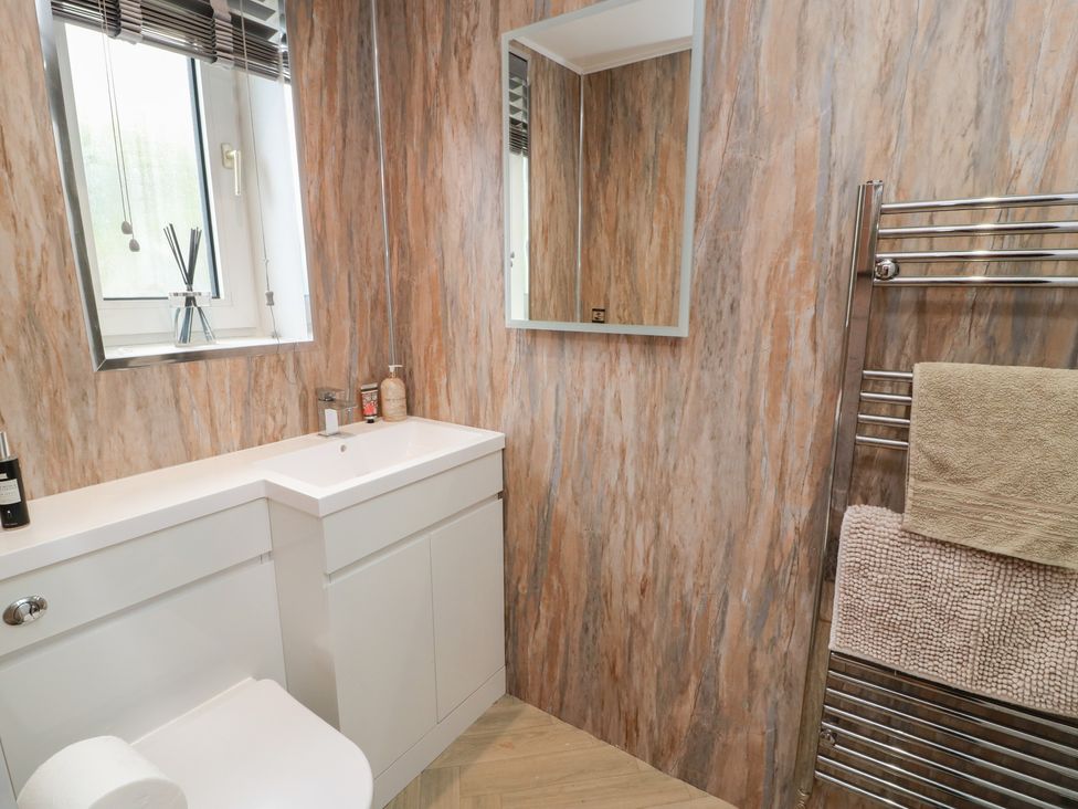A bathroom with a sink and toilet at Olea in Portpatrick