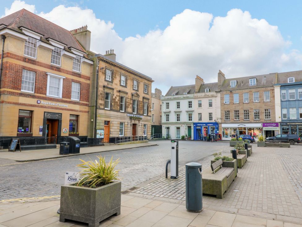 A street view of banks and shops at Woodmarket Apartments in Kelso