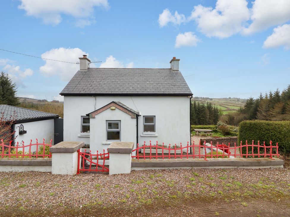 A house with a fence and pathway at Turraheen in Cashel