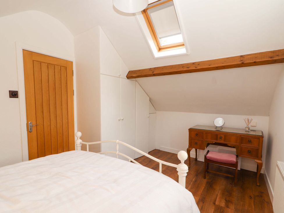 A bedroom with a bed and desk at Turraheen in Cashel