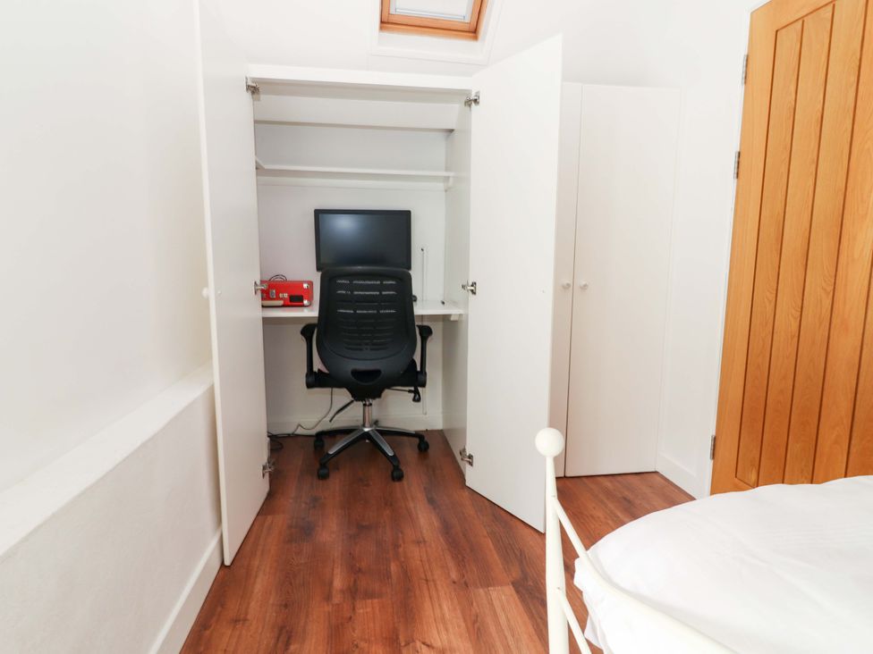 A home office with a desk and computer at Turraheen in Cashel