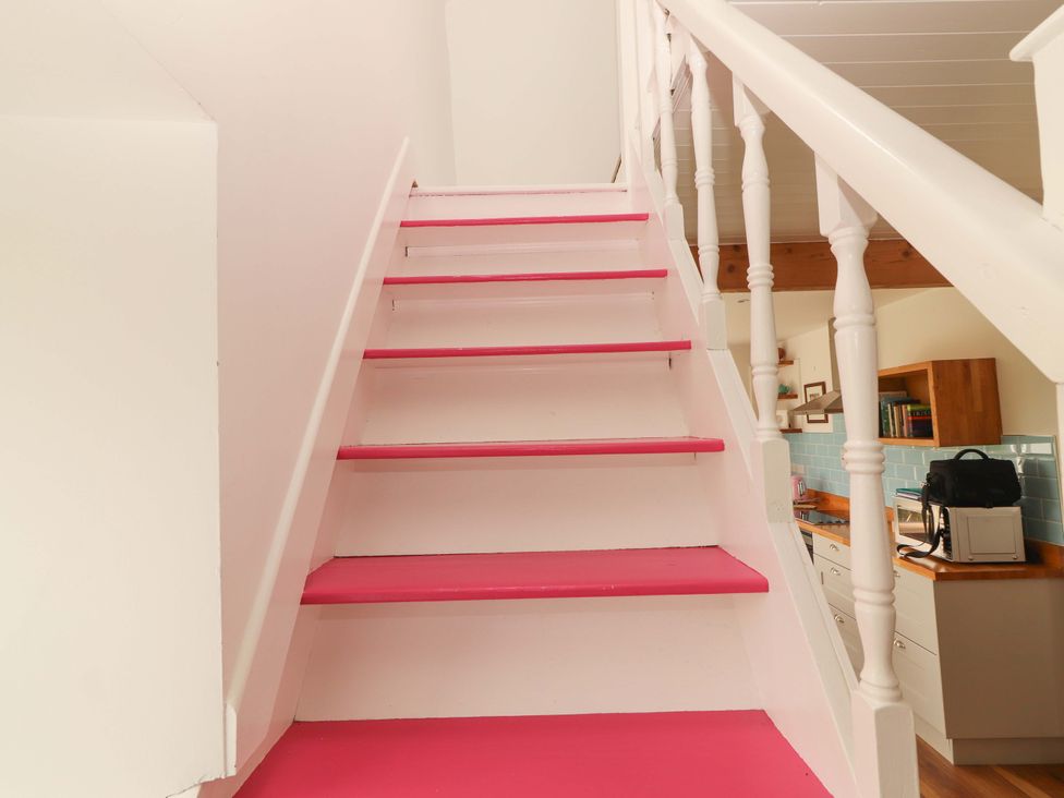 Stairs leading to a kitchen area at Artist’s Cottage Cashel, County Tipperary