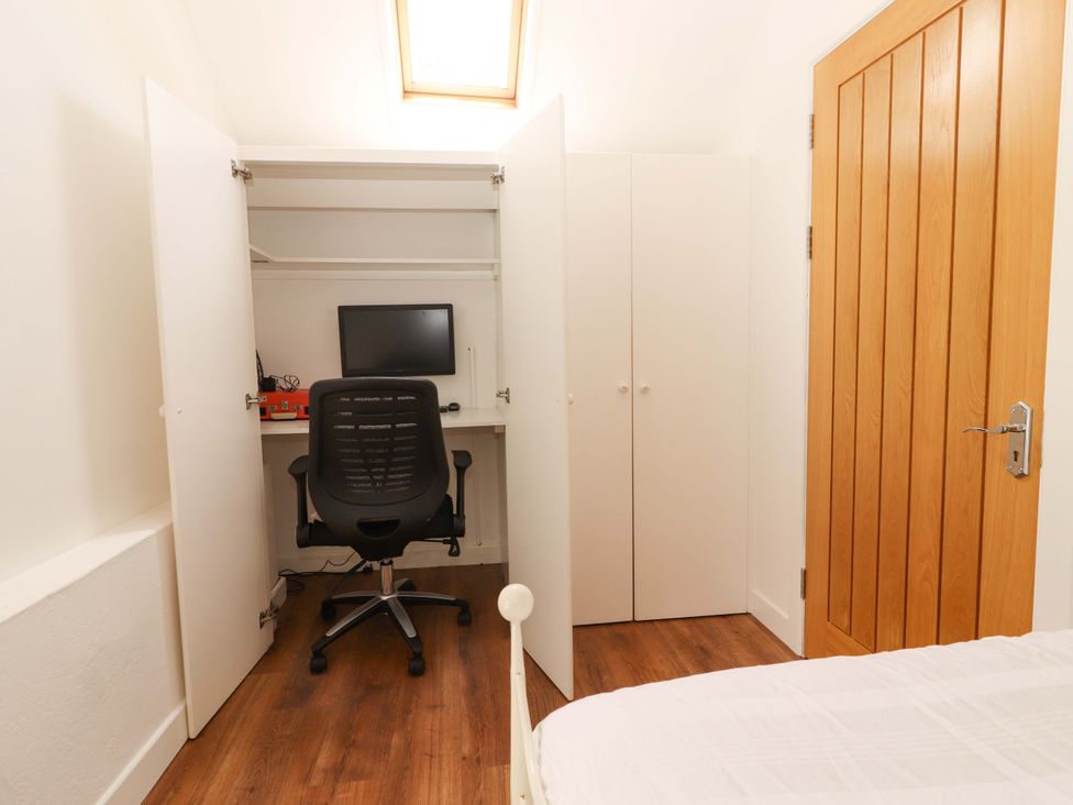An office space with a desk and computer at Artist’s Cottage in Cashel, County Tipperary