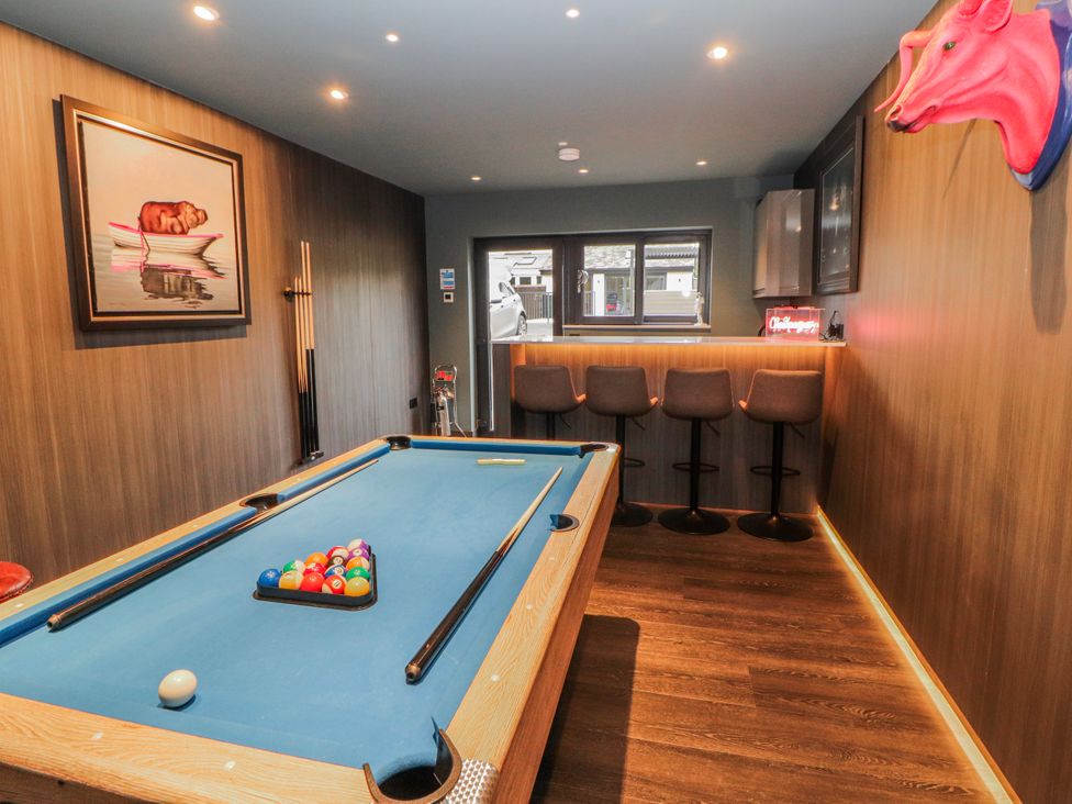 A snug with a pool table and bar stools at Bounty Boutique on the Lakes Bowness-On-Windermere