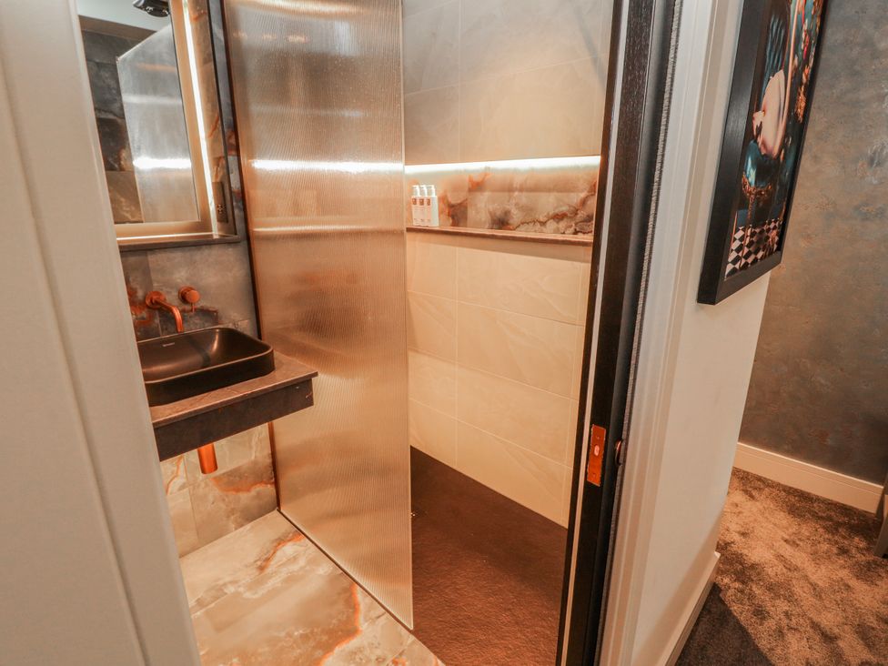 A bathroom with a sink and shower at Bounty Boutique on the Lakes Bowness-On-Windermere