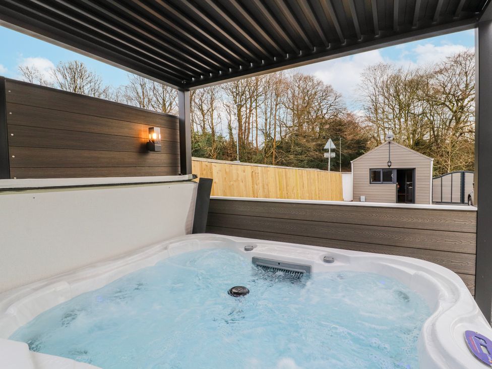 A hot tub in an outdoor area at Bounty Boutique on the Lakes Bowness-On-Windermere