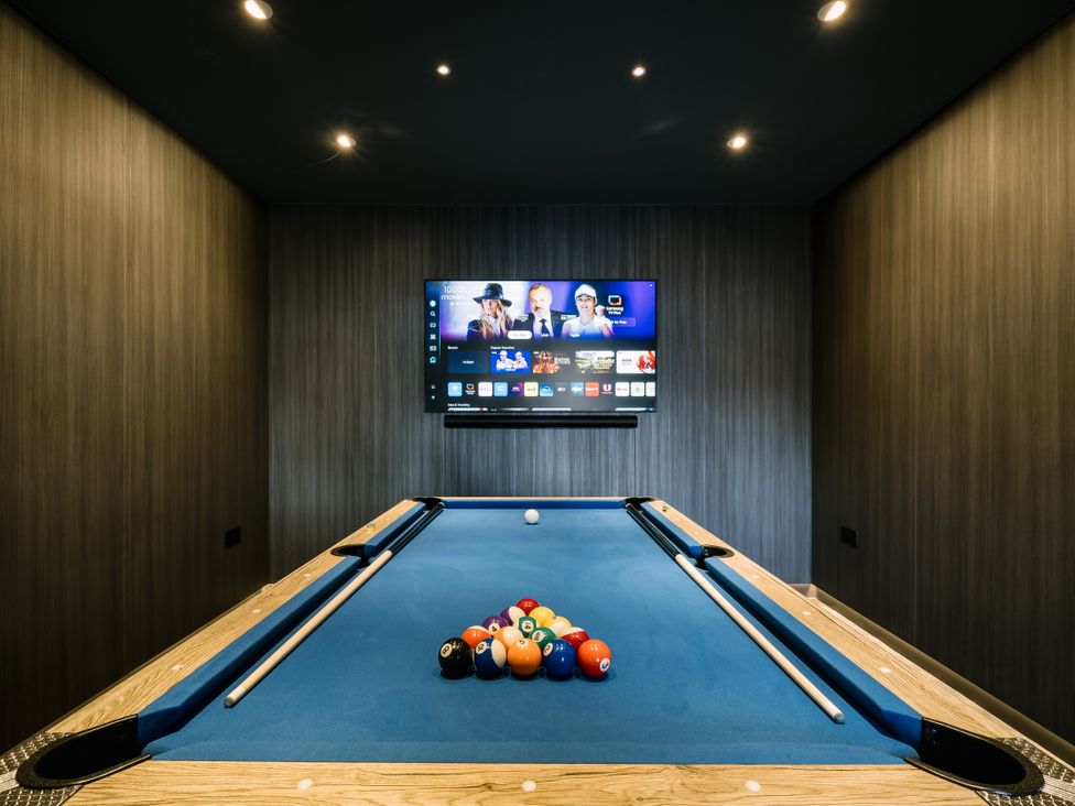 A game room with a pool table and television at Bounty Boutique on the Lakes in Bowness-On-Windermere